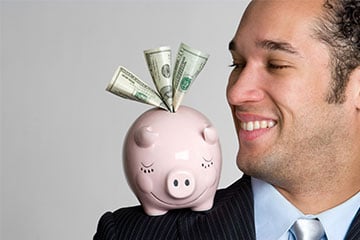 Man holding piggy bank financial success